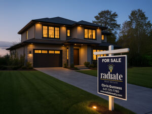 Radiate Real Estate For Sale sign in front of a modern GTA home at dusk.